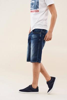 BERMUDAS LOOSE JOGGER CON ROTOS EN DENIM AZUL